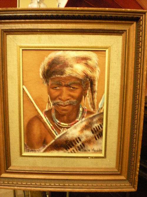 MIZRAIM MASEKO LEATHER TOOLED ZULU WARRIOR OF THE ''CELE'' CLAN INSCRIBED ON BACK