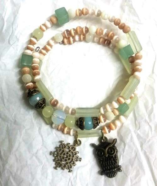 Spiral wrap chakra bracelet, aventurine, opaline and shell beads.