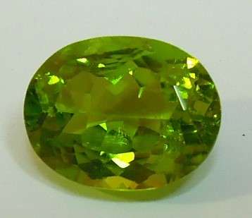 Certified Apple Green Peridot - I1, 3.48 ct. - Oval Faceted