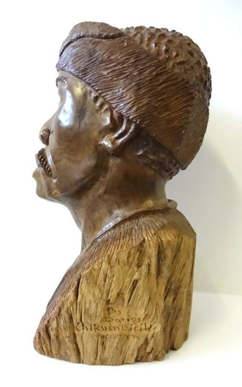darios chikumbirike wood  sculpture