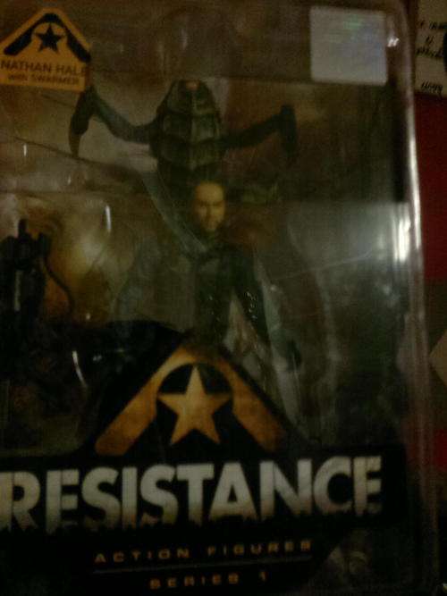 carded resistance figure with bug