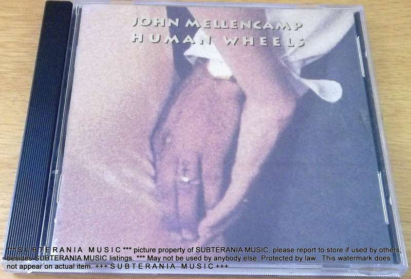 JOHN MELLENCAMP Human Wheels  [Shelf G Box 8 + main stock room]