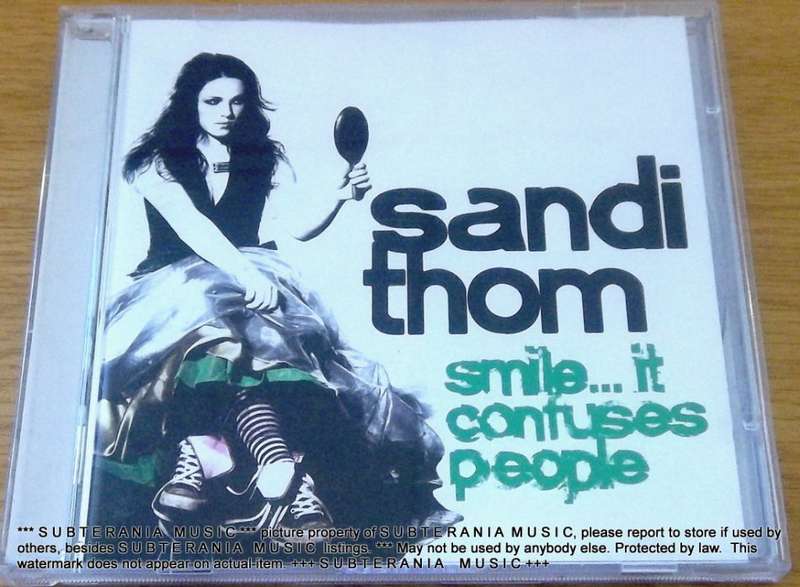 SANDI THOM Smile ... It Confuses People  [Shelf G Box 15]