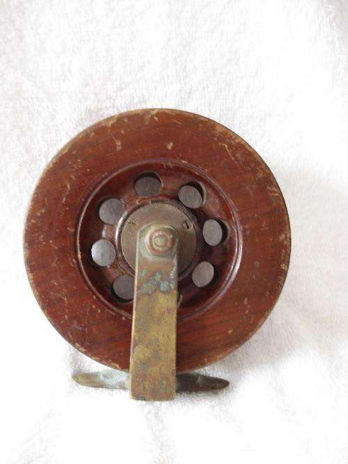 wood and brass reel