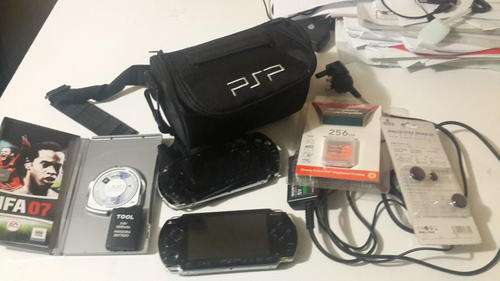 PSP console with carry case, game and extras
