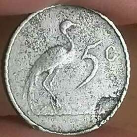Error 1968E 5c. Flawed planchet at bottom right below 5c and weak strike on head.