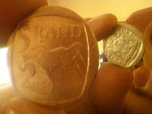 Multiple error 1994 R5. Rotated die, weak strike, smooth edge AND extra heavy (7.25gm) normal= 7.0gm