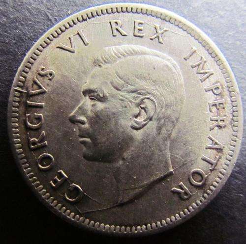 Error 1942 SA Shilling with unusually long cracked die lines on neck and below, as well as at legend