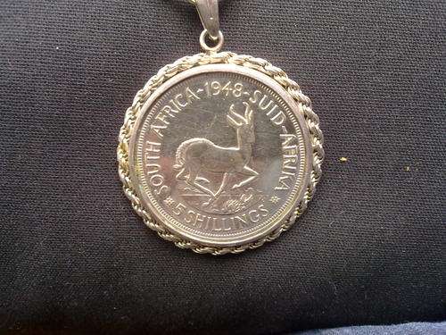 Vintage sterling silver pendant on a chain with a very large silver 1948 SA 5 shillings. Chain= 66cm