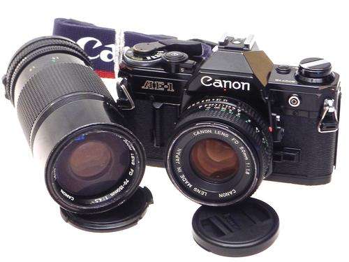 Black Canon AE-1 with FD 50mm 1,8 and FD 75-150mm***Nice,Working Kit***