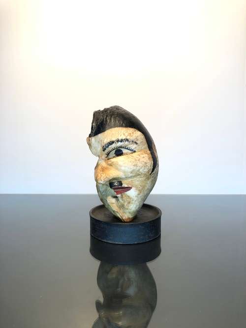A Rare 19th Century Scrimshaw Hand Painted Whale Ear Bone