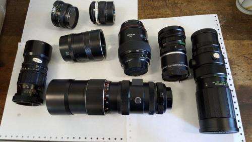 A COLLECTION OF CAMERA LENSES  SHIPPING R70