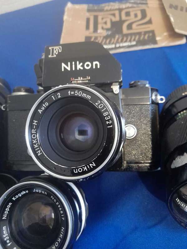 Nikon f black paint 35mm camera plus 4 lens