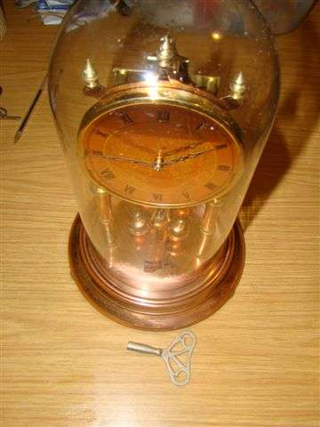 A West German made copper and brass DOME CLOCK, 31cm high.working but will sell as is shipping will