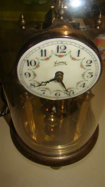 A GERMAN ANNIVERSARY 400 DAY CLOCK, PLASTIC DOME SOLD  AS IS.  I tried to capture most of the damage