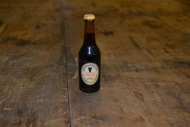 Miniature Guinness Advertising bottle.