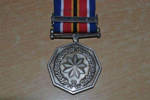 Full Size SANDF Tshumelo Ikatelaho Medal. Second type with Peace Humanitarian Aid Clasp.