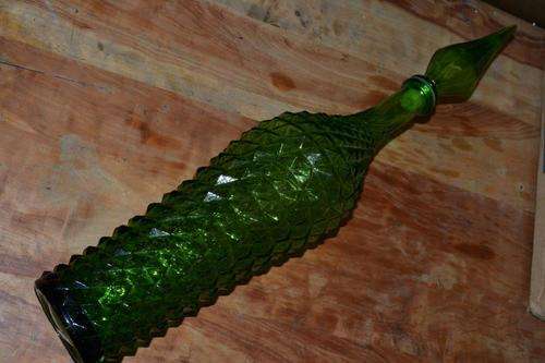 Large green bottle with stopper.