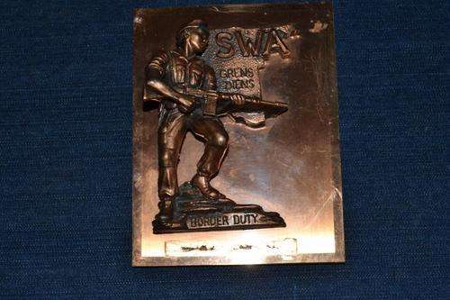 Border duty plaque. Hat broken