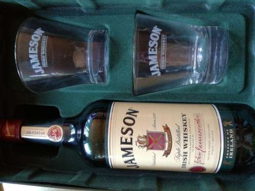JAMESON IRISH WISKEY IN COLLECTABLE STEEL BOX WITH CLASSES. SEE IMAGES