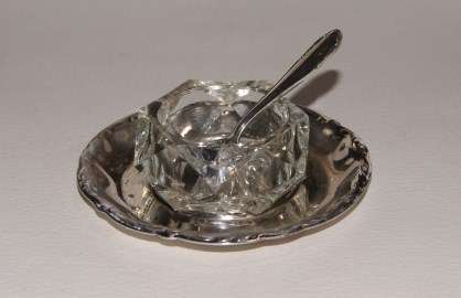 FOUR SALTS WITH WMF SILVER PLATED UNDER PLATES AND SCOOP SPOONS