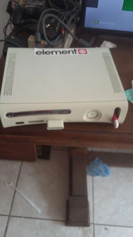 xbox 360 with 2 controllers and all cables and plays pirated games
