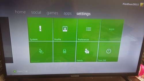 xbox 360 with 2 controllers and all cables and plays pirated games
