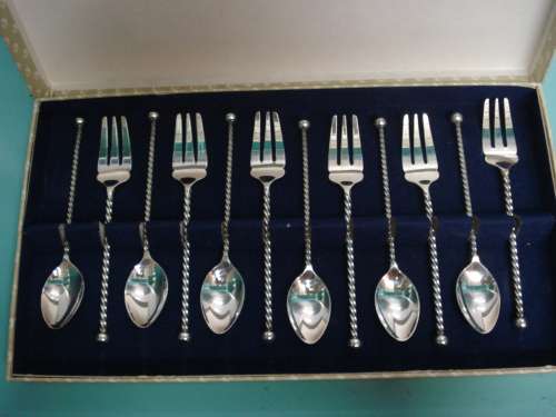 12pc Magnificent set of matching silver cake forks and teaspoons box set silver ..?