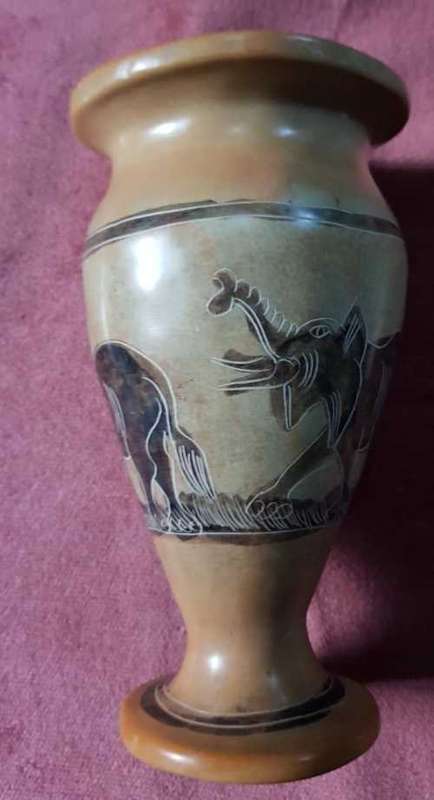 Ceramic vase with elephant images