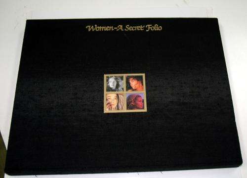 Women A Secret Folio coffee table book embossed black silk with gilt stripe in matching slipcase