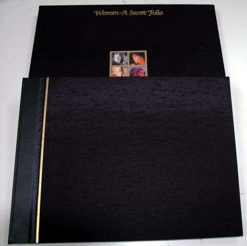 Women A Secret Folio coffee table book embossed black silk with gilt stripe in matching slipcase