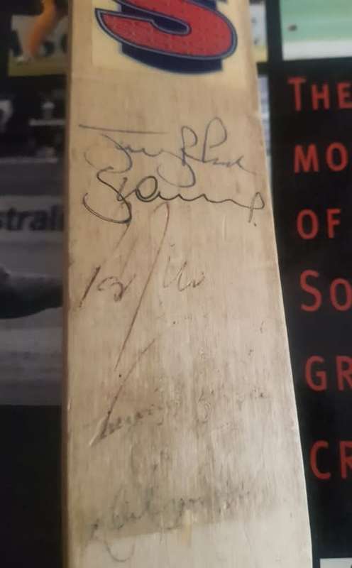 Jonty in Pictures AND Cricket bat Signed by Jonty Rhodes