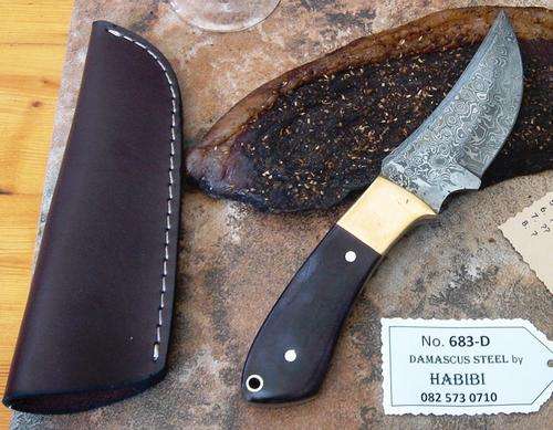 Damascus steel Biltong Knife. Brass/Bone/Wood, leather sheath. Was R 1950.00. NOW ONLY R999.00