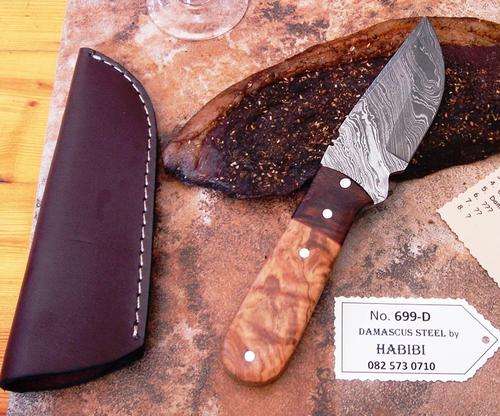 Damascus steel Biltong Knife. Brass/Bone/Wood, leather sheath. Was R 1950.00. NOW ONLY R899.00