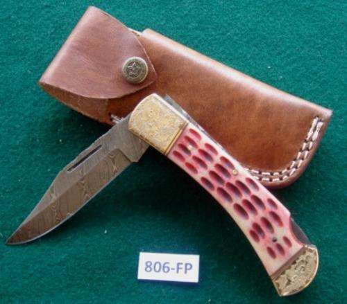 Damascus steel Biltong Knife. Brass/Bone/Wood, leather sheath. Was R 1950.00. NOW ONLY R1099.00