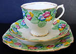 ART DECO ROYAL ALBERT CROWN CHINA ENGLAND "PRIMROSE" TRIO (1527) CUP - SAUCER AND TEA/SIDE PLATE