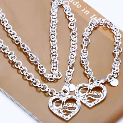 Designer's Guess Silver and Crystals Heart Shaped Bracelet and Necklace Set *imported