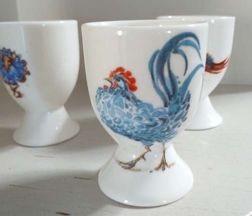 THREE HANDPAINTED EGG-CUPS BY JANE ABBOTT