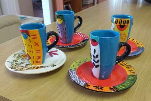 FOUR ESPRESSO CERAMIC CUPS AND SAUCERS BY ELSONA CERAMICS