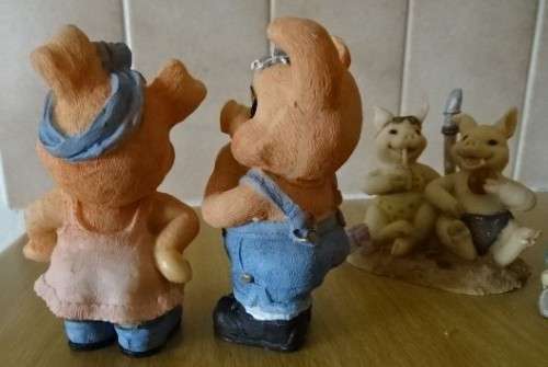 FOUR PIGGY ORNAMENTS