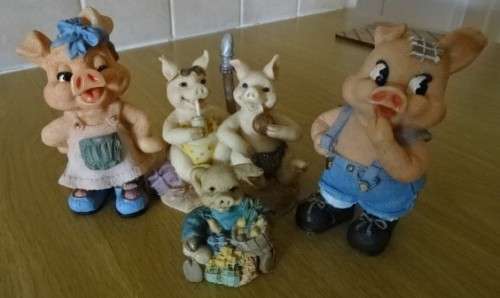 FOUR PIGGY ORNAMENTS