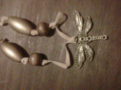 Bronze alloy dragonfly on leather with wooden beads