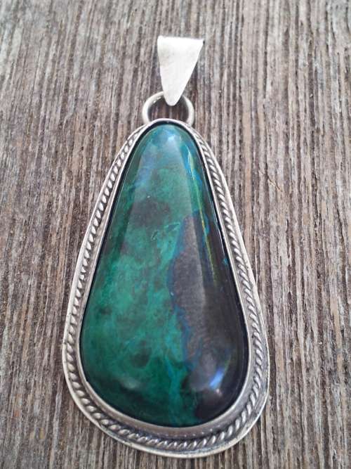 Sterling silver thick bezel and dark green malachite pendant.