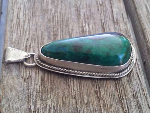 Sterling silver thick bezel and dark green malachite pendant.