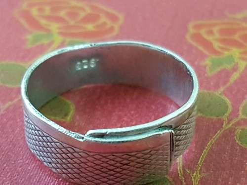 Hand made Sterling Silver ring. Engine turned pattern on the band. Marked 925.