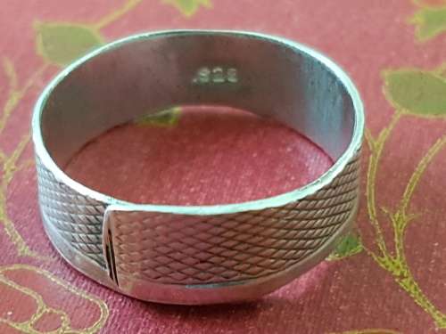 Hand made Sterling Silver ring. Engine turned pattern on the band. Marked 925.