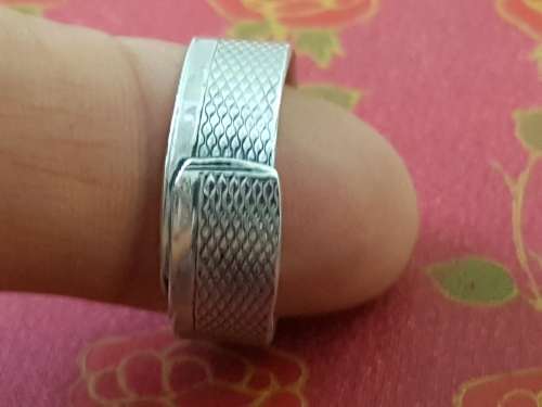 Hand made Sterling Silver ring. Engine turned pattern on the band. Marked 925.