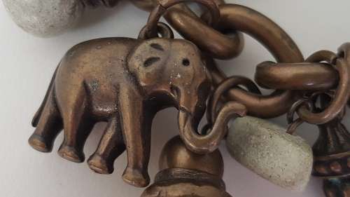 NEW never worn Designer Charm Bracelet! Detachable Bronze Metal Elephants and Soapstones. 20 cm.