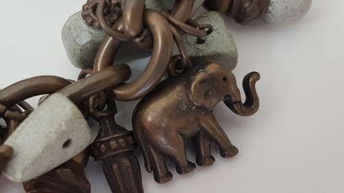 NEW never worn Designer Charm Bracelet! Detachable Bronze Metal Elephants and Soapstones. 20 cm.