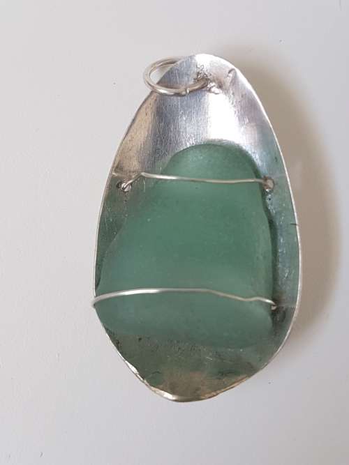 Smoky Seaglass in solid silver oval  setting with silver wire. 9.9  g!